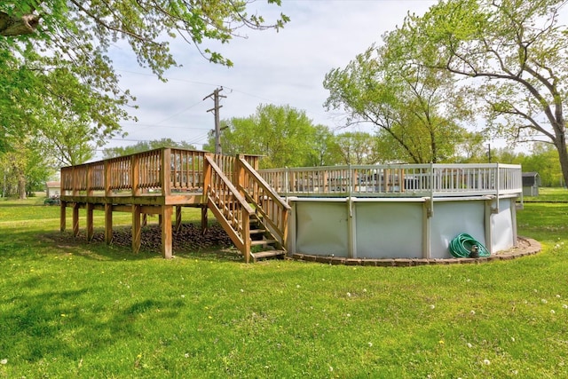 20347 Burnham Ave, Lynwood, IL 60411 - back of property with a wooden deck, a lawn, an outdoor pool, and stairway