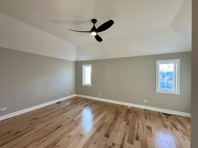 302 S 7th Ave, Maywood, IL 60153 - spare room featuring wood finished floors, ceiling fan, baseboards, and vaulted ceiling