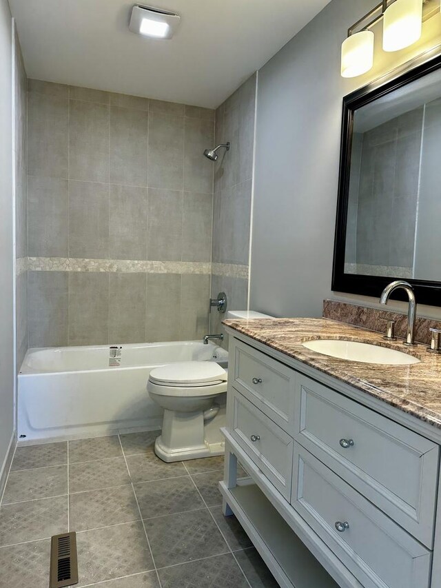302 S 7th Ave, Maywood, IL 60153 - bathroom with toilet, tile patterned flooring, shower / washtub combination, and vanity