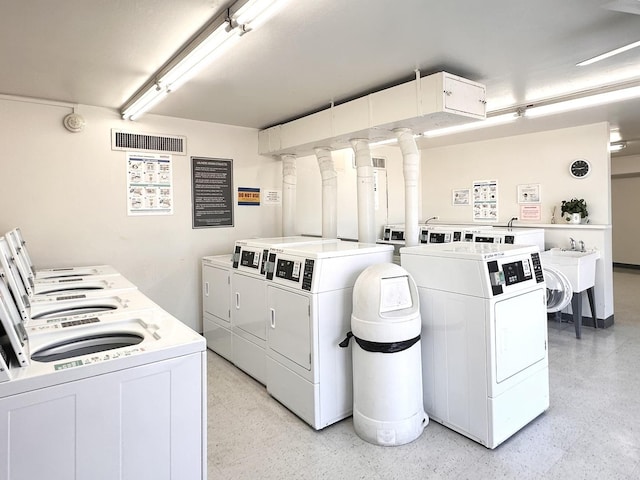 1415 E Central Rd Unit 421C, Arlington Heights, IL 60005 - communal laundry room featuring washer and clothes dryer