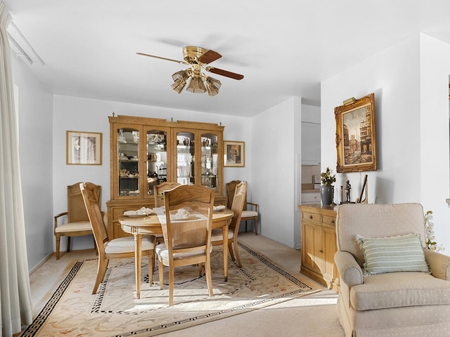 1415 E Central Rd Unit 421C, Arlington Heights, IL 60005 - dining room with a ceiling fan and light carpet