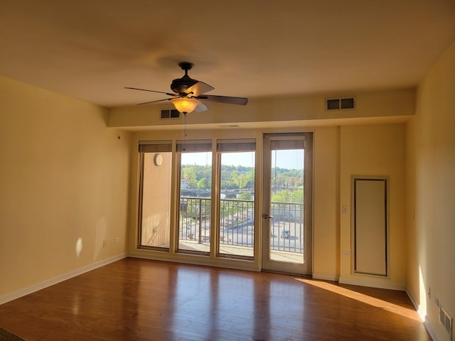 50 S Grove Ave Unit 510, Elgin, IL 60120 - empty room featuring wood finished floors, a ceiling fan, and baseboards