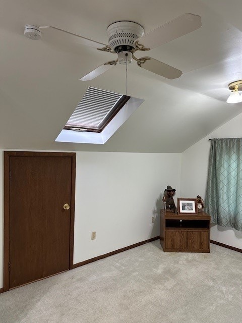 3806 Juniper Ave, Joliet, IL 60431 - additional living space with vaulted ceiling, light carpet, ceiling fan, and baseboards