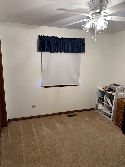 3806 Juniper Ave, Joliet, IL 60431 - spare room featuring a ceiling fan, light carpet, and baseboards