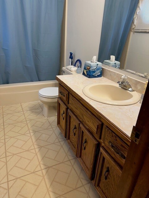 3806 Juniper Ave, Joliet, IL 60431 - bathroom with vanity, shower / bath combination with curtain, and toilet
