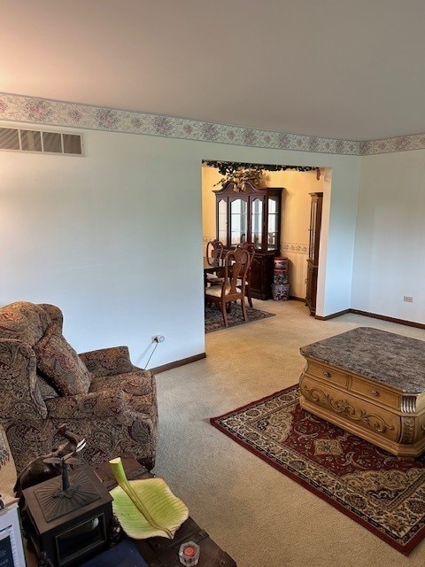 3806 Juniper Ave, Joliet, IL 60431 - living room featuring a chandelier, light colored carpet, and baseboards