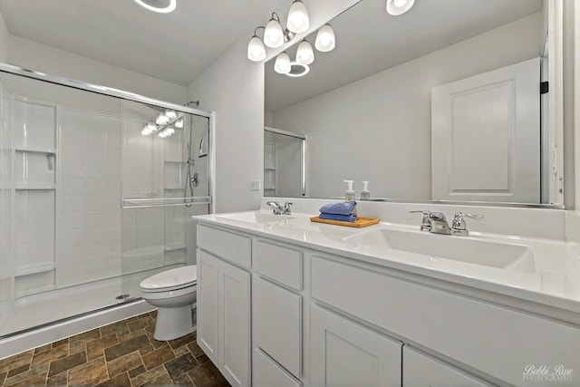 2451 Alison Ave, Pingree Grove, IL 60140 - full bathroom featuring toilet, stone finish floors, a shower stall, and double vanity