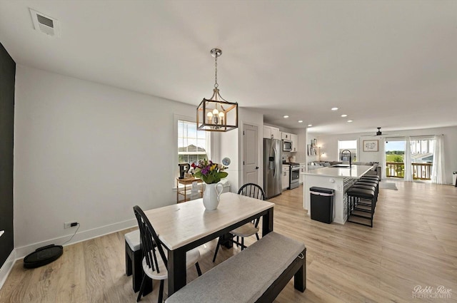2451 Alison Ave, Pingree Grove, IL 60140 - dining space with light wood-type flooring, a chandelier, recessed lighting, and baseboards