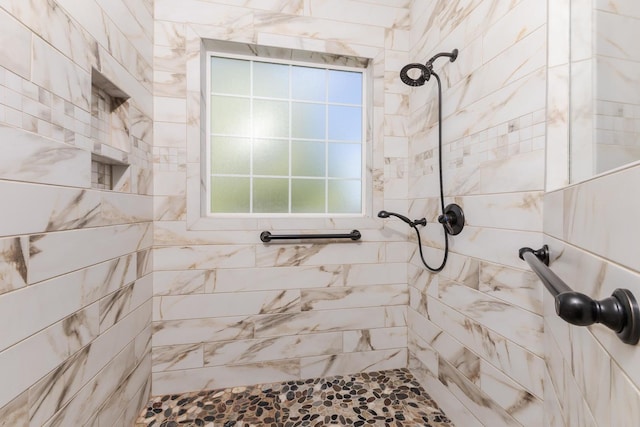 bathroom with tiled shower