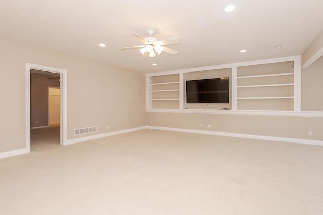 spare room with ceiling fan, light carpet, baseboards, recessed lighting, and built in features