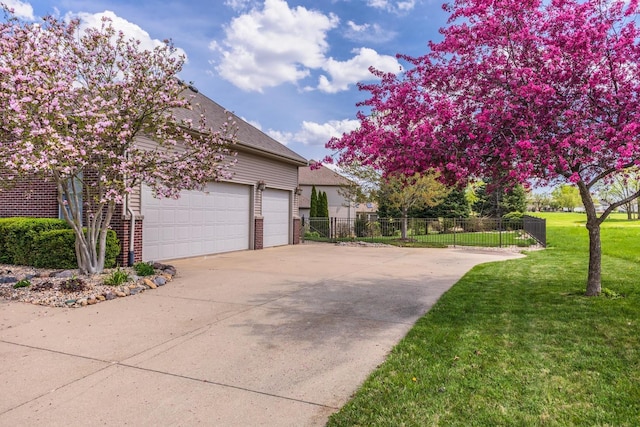 view of side of home with brick siding and concrete driveway