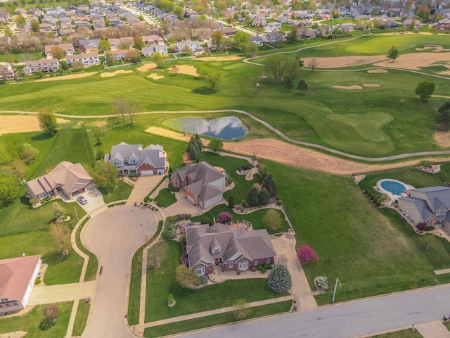 aerial overview of property's location featuring nearby suburban area and a large body of water