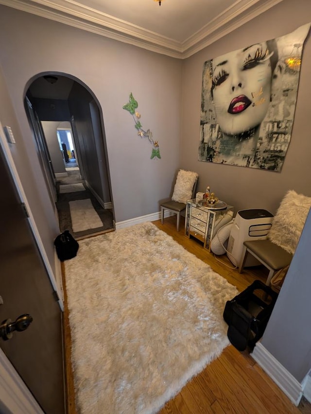 6850 S S Shore Dr Unit 2N, Chicago, IL 60649 - living area featuring arched walkways, wood finished floors, ornamental molding, and baseboards