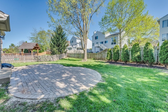 view of yard with a gazebo, a patio area, and a residential view