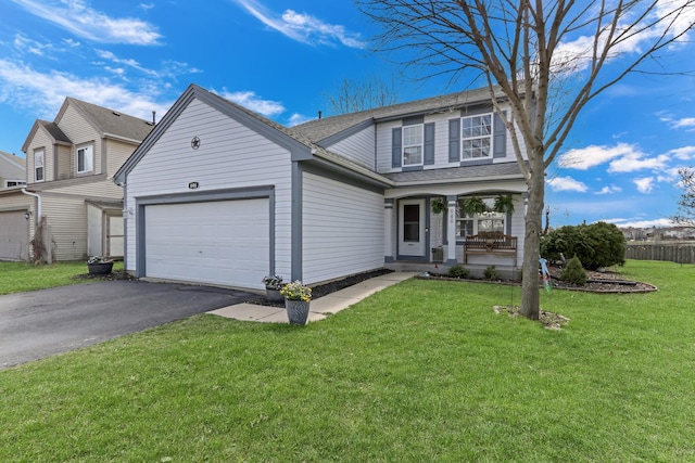 646 E Weston Ct, Round Lake Beach, IL 60073 - traditional-style home with an attached garage, driveway, covered porch, and roof with shingles