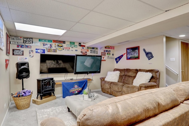 646 E Weston Ct, Round Lake Beach, IL 60073 - living area with a drop ceiling, a wood stove, carpet, and baseboards