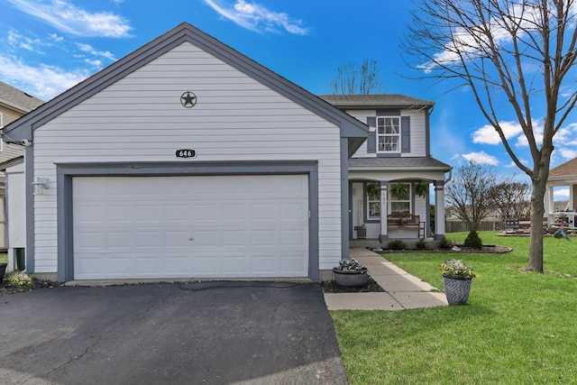 646 E Weston Ct, Round Lake Beach, IL 60073 - traditional home featuring covered porch, driveway, a front lawn, an attached garage, and roof with shingles