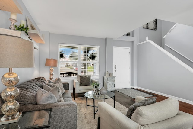 646 E Weston Ct, Round Lake Beach, IL 60073 - living room with wood finished floors, stairway, and baseboards