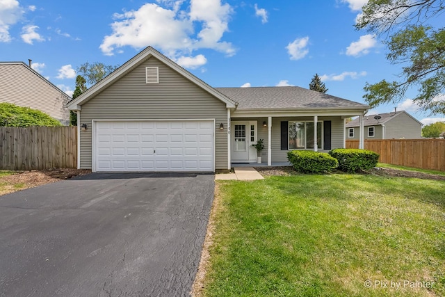 1140 Division St, Geneva, IL 60134 - ranch-style house featuring asphalt driveway, an attached garage, covered porch, and a shingled roof