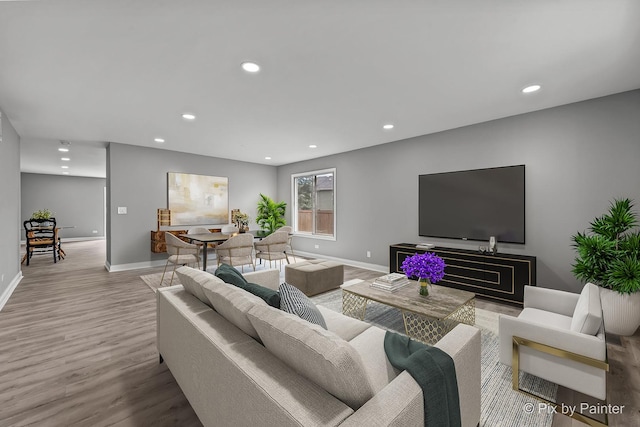 1140 Division St, Geneva, IL 60134 - living room featuring baseboards, wood finished floors, and recessed lighting
