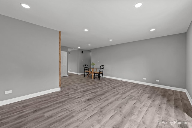 1140 Division St, Geneva, IL 60134 - unfurnished room with wood finished floors, baseboards, and recessed lighting