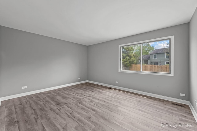 1140 Division St, Geneva, IL 60134 - unfurnished room featuring wood finished floors and baseboards