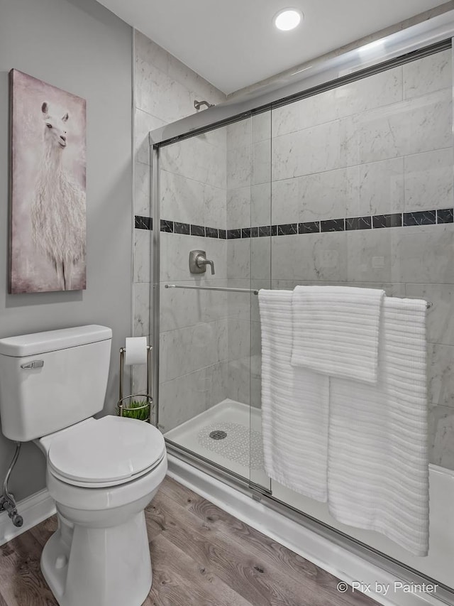 1140 Division St, Geneva, IL 60134 - full bath featuring a stall shower, wood finished floors, toilet, and recessed lighting