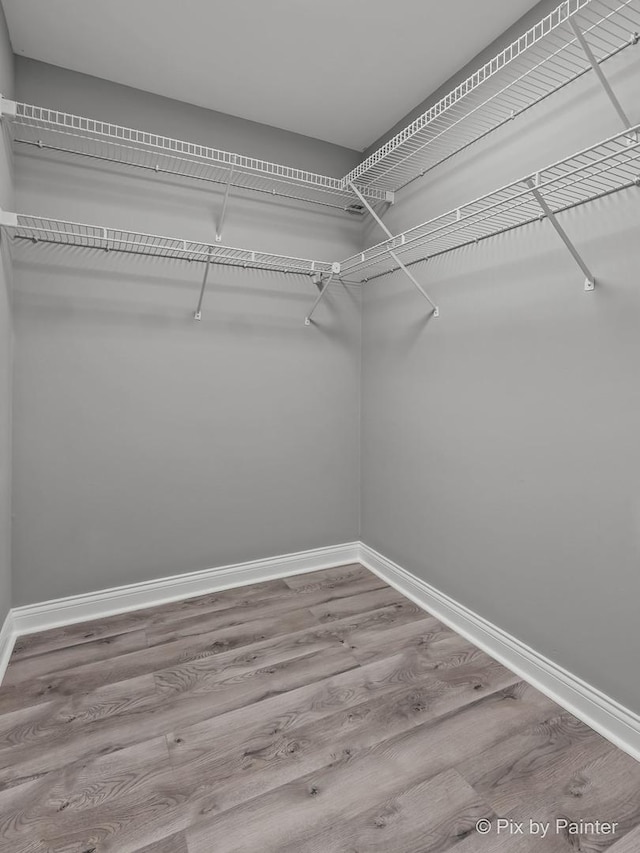 1140 Division St, Geneva, IL 60134 - spacious closet featuring wood finished floors