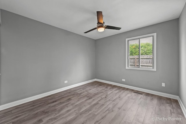 1140 Division St, Geneva, IL 60134 - unfurnished room featuring wood finished floors, baseboards, and a ceiling fan