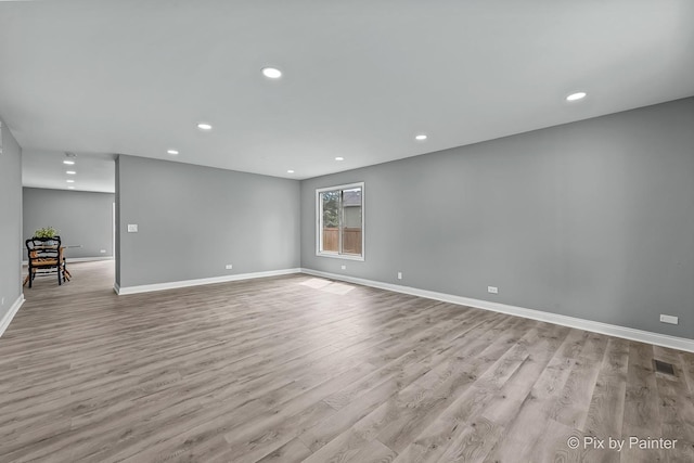1140 Division St, Geneva, IL 60134 - empty room featuring wood finished floors, baseboards, and recessed lighting