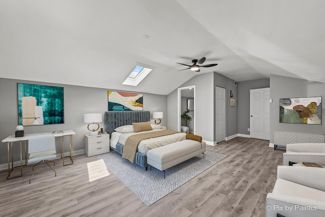 1140 Division St, Geneva, IL 60134 - bedroom featuring a skylight, light wood finished floors, lofted ceiling, and baseboards