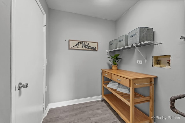 1140 Division St, Geneva, IL 60134 - washroom featuring hookup for a washing machine, baseboards, and wood finished floors