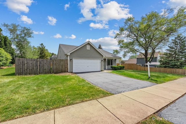 1140 Division St, Geneva, IL 60134 - view of front of home featuring asphalt driveway and a garage