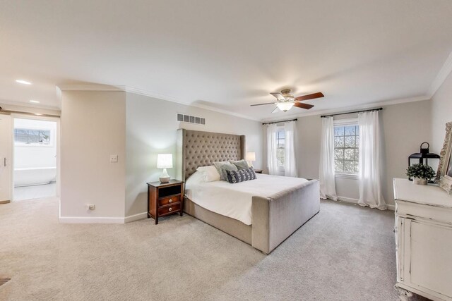 bedroom featuring crown molding, light colored carpet, baseboards, and ceiling fan