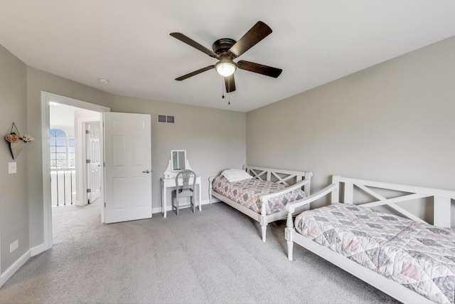 bedroom featuring carpet floors, baseboards, and ceiling fan