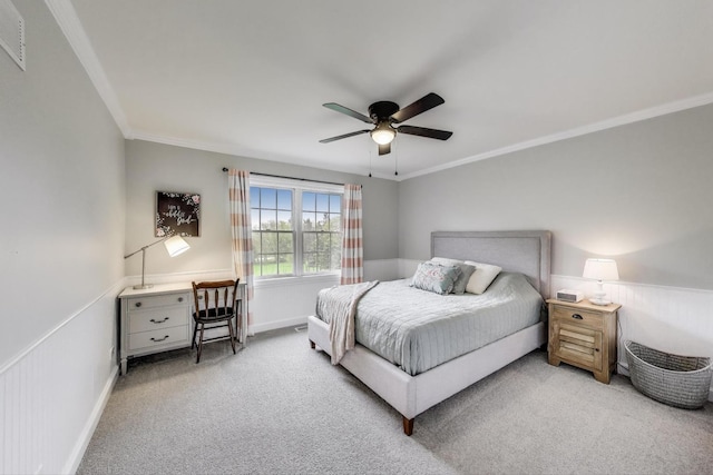 bedroom with carpet, ornamental molding, a ceiling fan, and baseboards