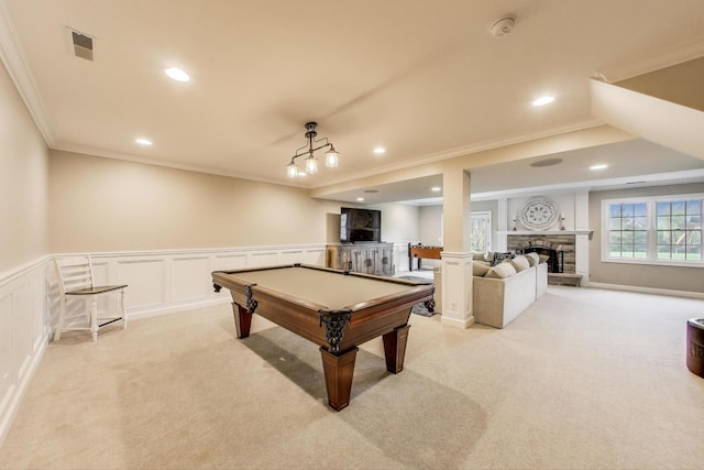playroom with crown molding, light carpet, a decorative wall, pool table, and a wainscoted wall