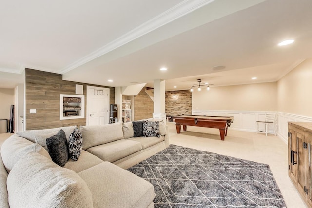 carpeted living room featuring crown molding, billiards, wainscoting, a decorative wall, and recessed lighting