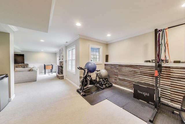 exercise room featuring crown molding, recessed lighting, carpet, and baseboards