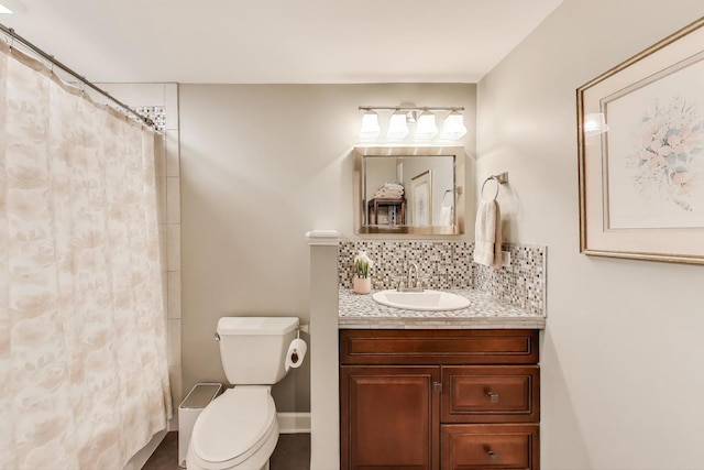 full bathroom featuring backsplash, toilet, vanity, and curtained shower