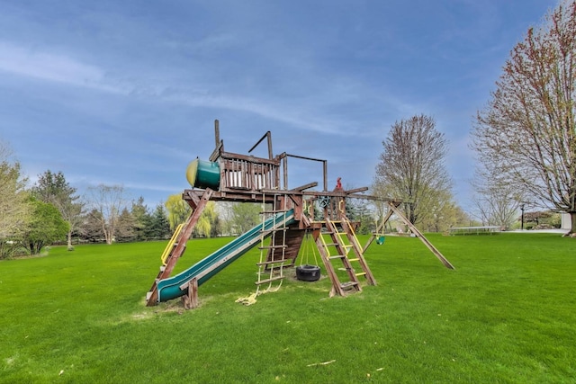 view of playground with a lawn