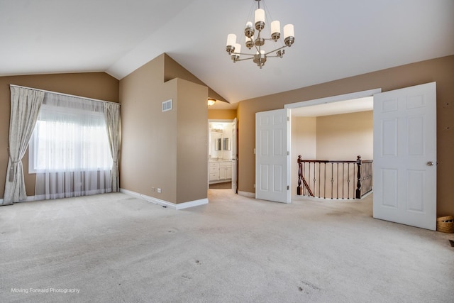 1770 Oxford Dr, Mundelein, IL 60060 - unfurnished room featuring vaulted ceiling, light carpet, a chandelier, and baseboards