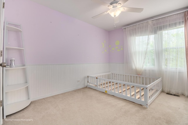 1770 Oxford Dr, Mundelein, IL 60060 - unfurnished bedroom featuring carpet flooring, a nursery area, and ceiling fan