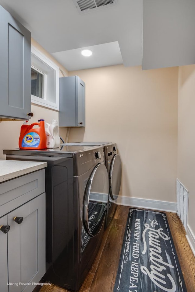 1770 Oxford Dr, Mundelein, IL 60060 - laundry room with washer and dryer, cabinet space, wood finished floors, and baseboards