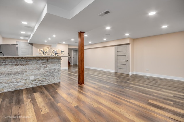 1770 Oxford Dr, Mundelein, IL 60060 - finished basement featuring dark wood-style flooring, baseboards, stairway, recessed lighting, and bar area