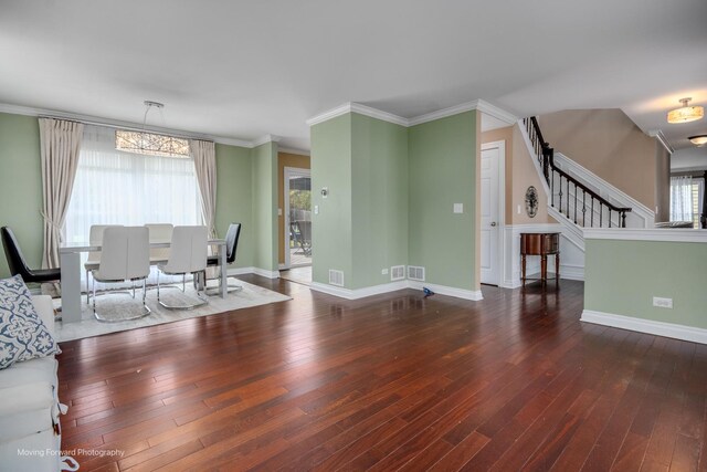 1770 Oxford Dr, Mundelein, IL 60060 - living area featuring hardwood / wood-style floors, a chandelier, stairs, crown molding, and baseboards