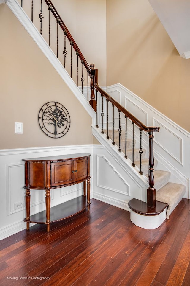 1770 Oxford Dr, Mundelein, IL 60060 - staircase featuring a decorative wall, wainscoting, and hardwood / wood-style flooring