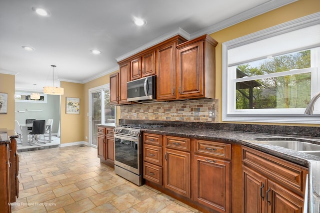1770 Oxford Dr, Mundelein, IL 60060 - kitchen with appliances with stainless steel finishes, backsplash, ornamental molding, baseboards, and a sink