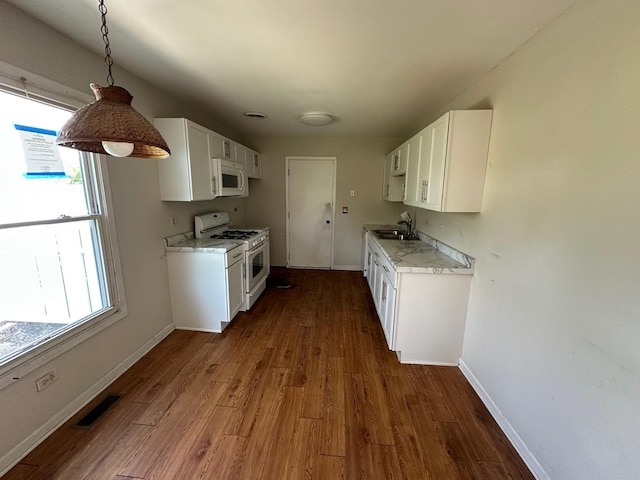 1118 Hampton Hbr Unit 1118, Schaumburg, IL 60193 - kitchen with white appliances, a sink, dark wood finished floors, and plenty of natural light