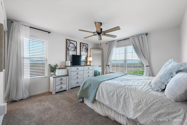 bedroom with carpet flooring, ceiling fan, and baseboards